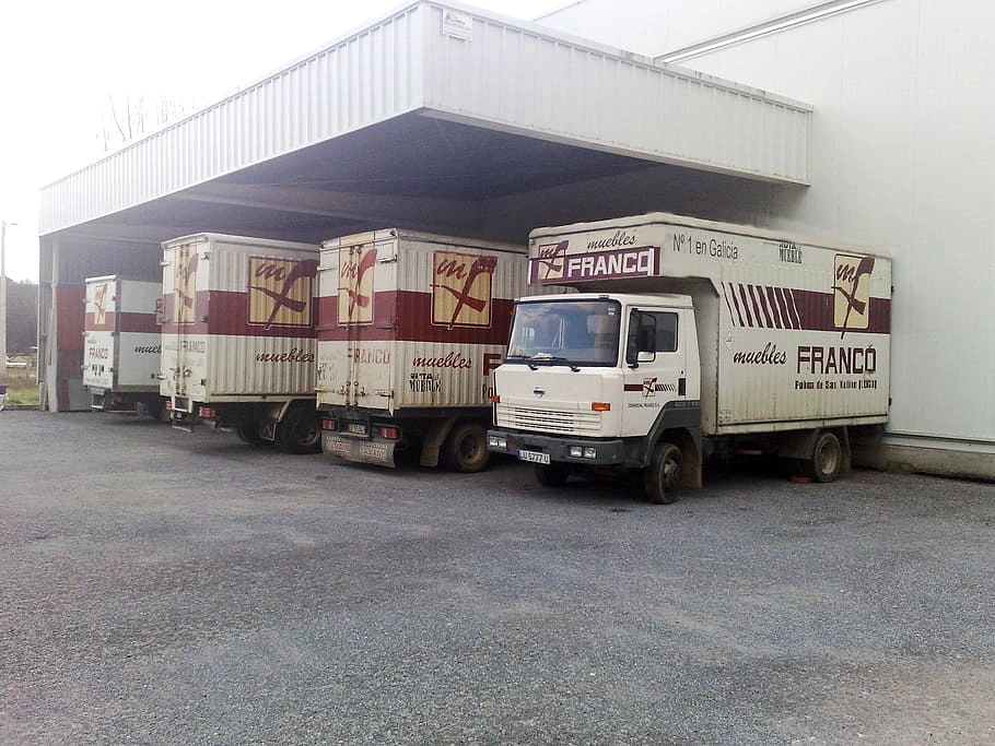 Box truck delivering goods to a business location
